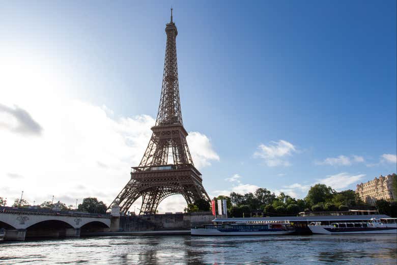 The Eiffel Tower stands on the banks of the Seine